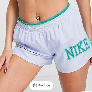 Nike Women's Light Blue Shorts with Green Accents